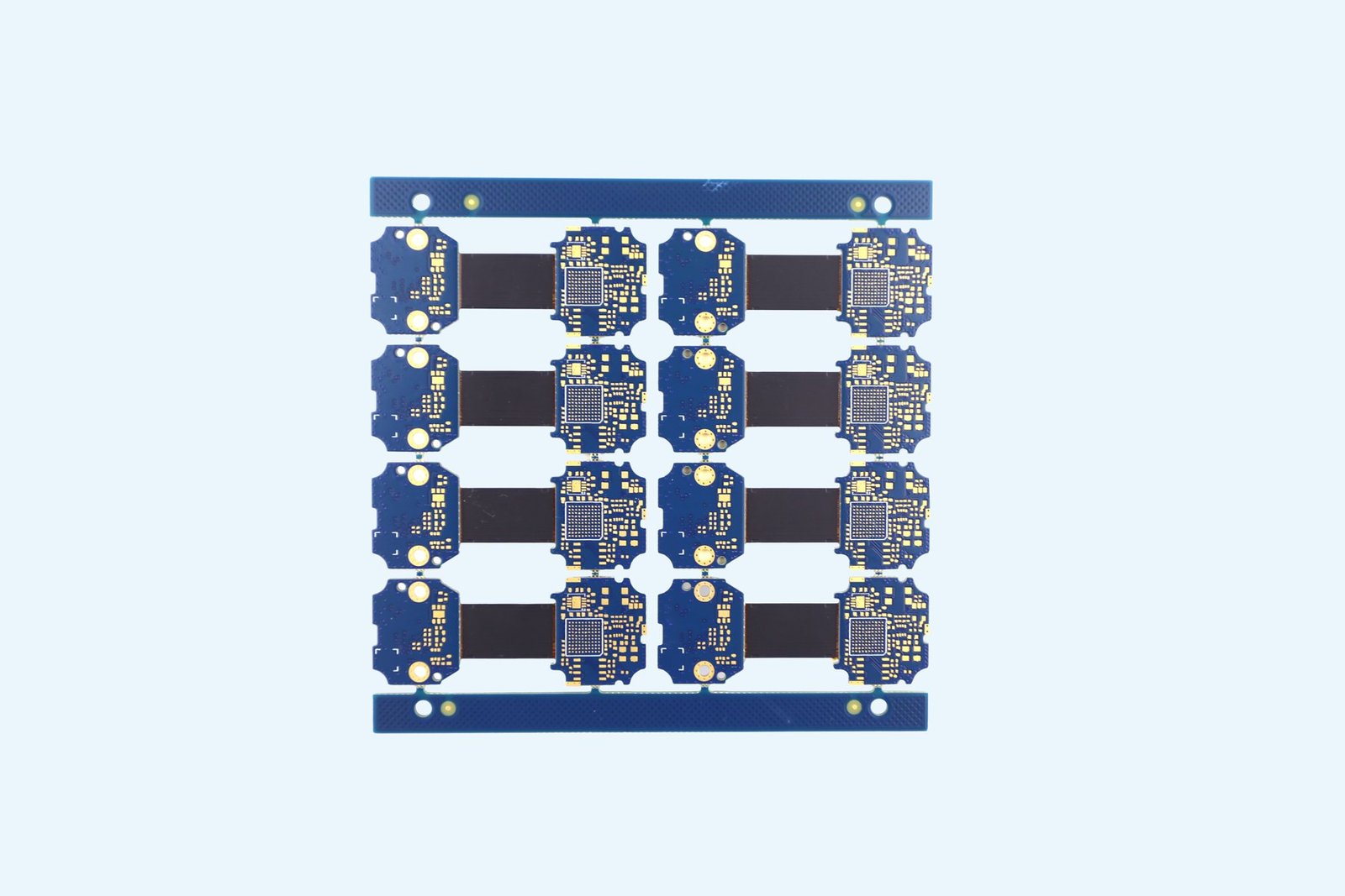 Blue bare PCB panel with circuit-board outlines and pads