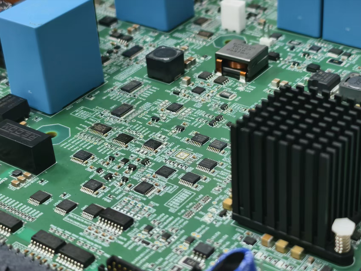 Fine-pitch PCBA with densely populated SMT components, relays and heat sink