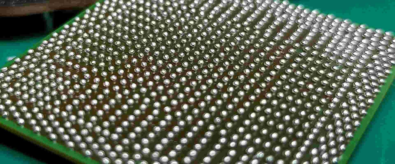 BGA solder-ball array | GlobalWellPCB Dense grid of metallic solder balls on the underside of a component package