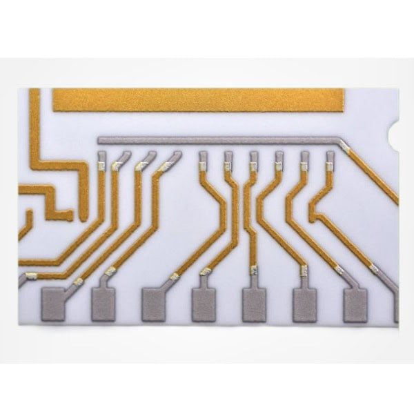 Ceramic circuit trace detail | GlobalWellPCB Close-up of copper circuit traces and contact pads on a white substrate