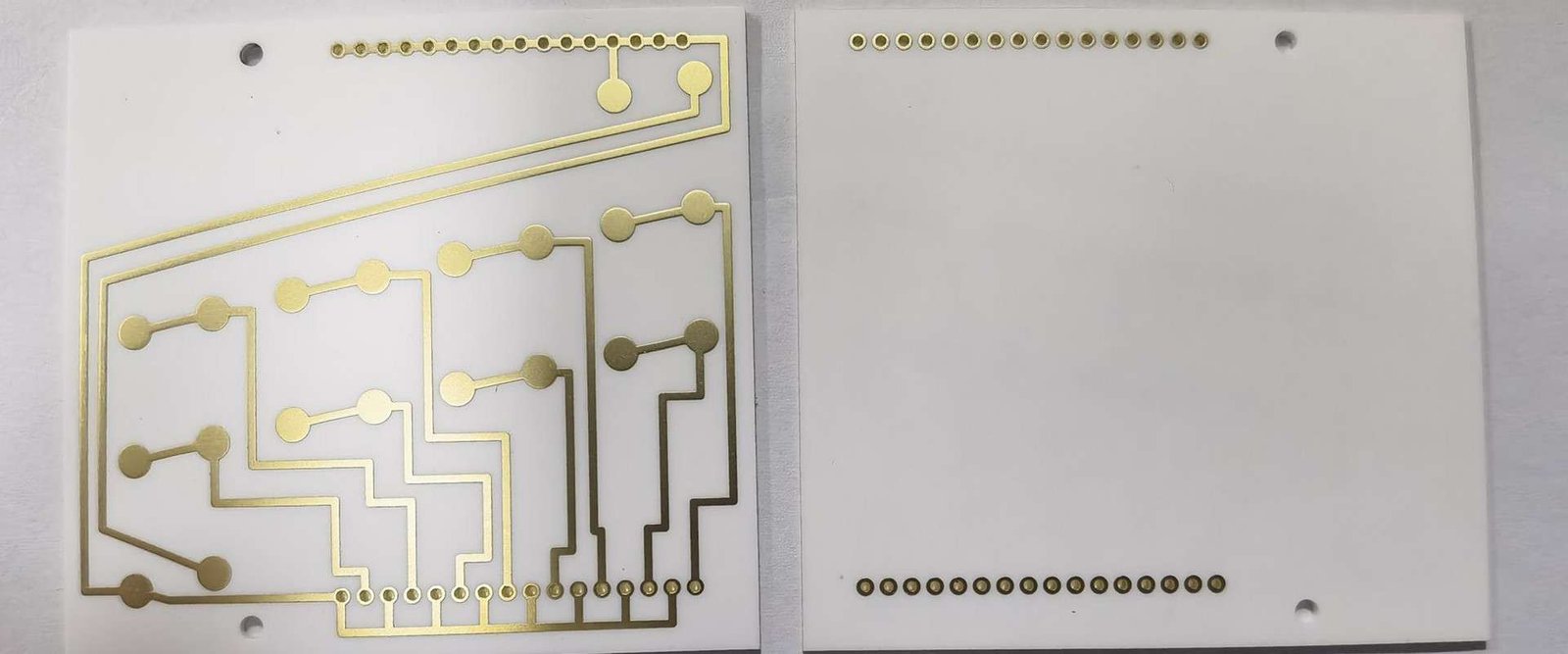 Ceramic circuit board front and back | GlobalWellPCB Front and back views of a white ceramic circuit substrate with metallized traces