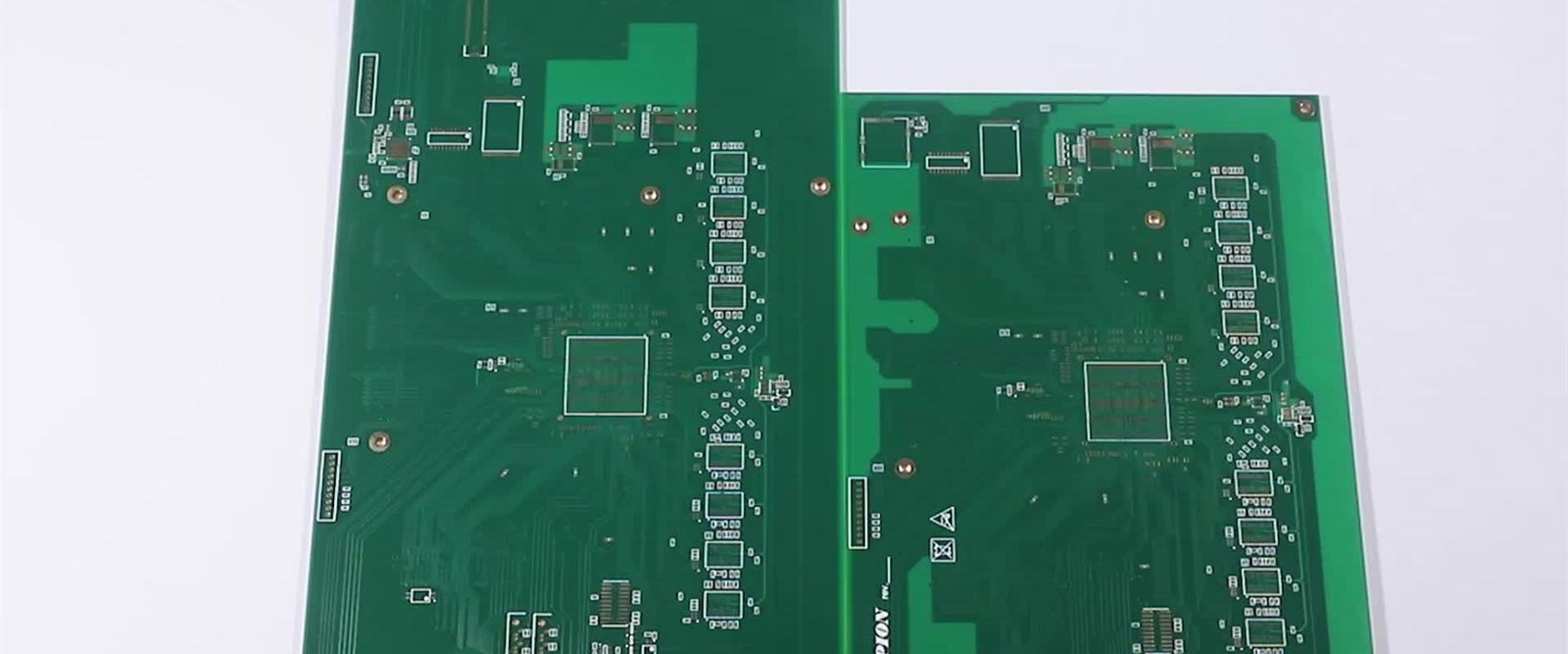 Green bare circuit board panel with copper paths and large mounting openings