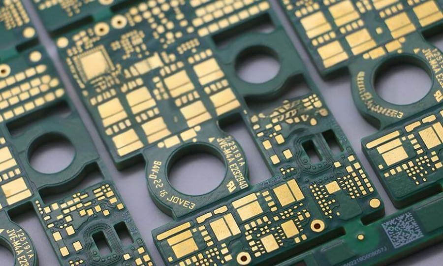 PCB routing and hole detail | GlobalWellPCB Dense circuit-board routing, gold-colored pads and drilled openings