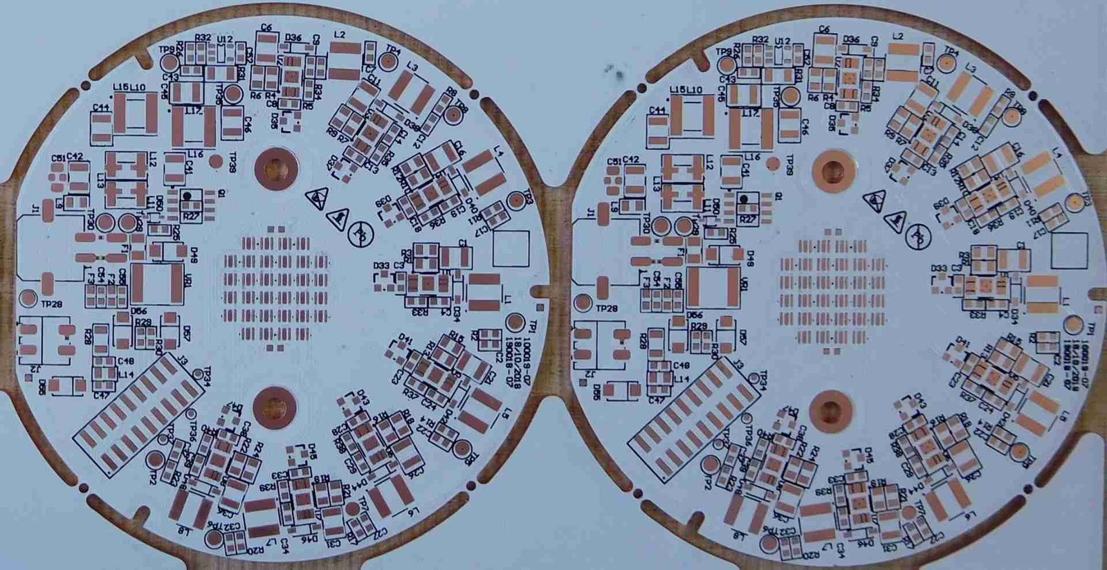 Circular lighting PCB panel | GlobalWellPCB Panel containing two circular lighting circuit boards with repeated component pads
