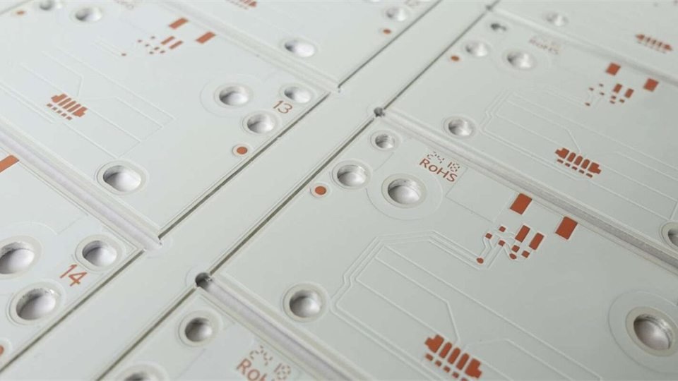 White lighting PCB panels | GlobalWellPCB White circuit-board panels with repeated lighting footprints and mounting holes
