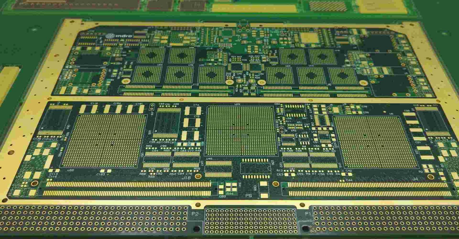 Multilayer PCB panel example | GlobalWellPCB Panel of bare circuit boards with dense traces, component pads and board outlines