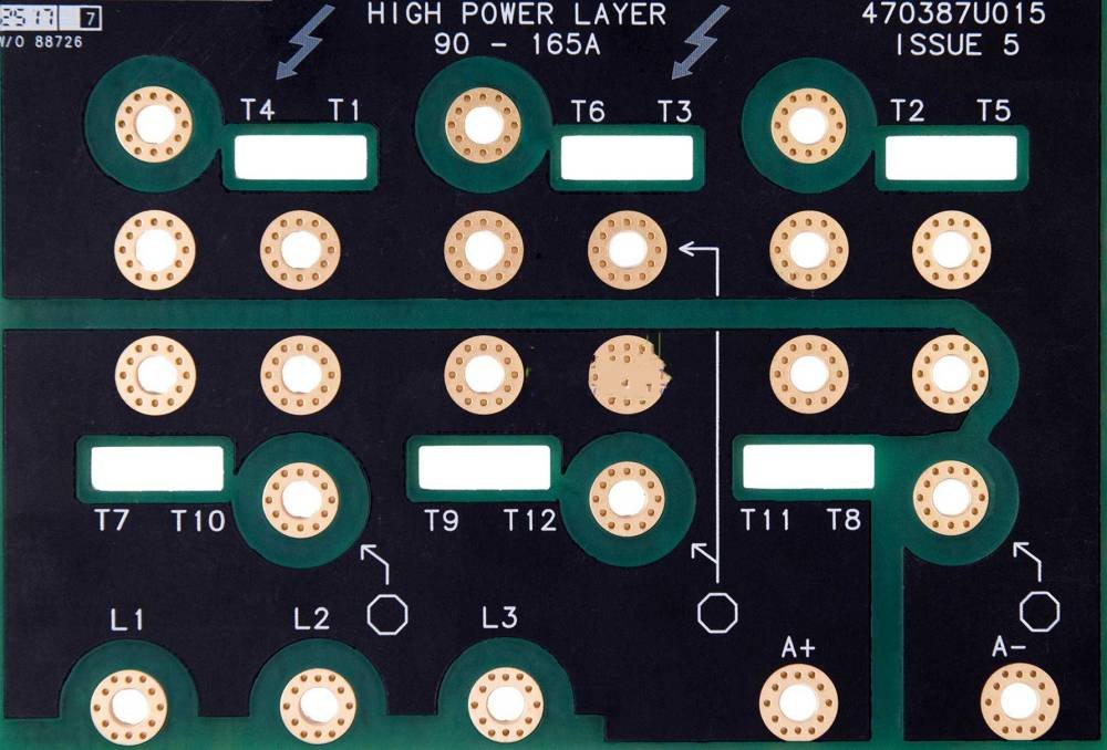 Bare circuit board with round terminal pads and rows of through-hole lands