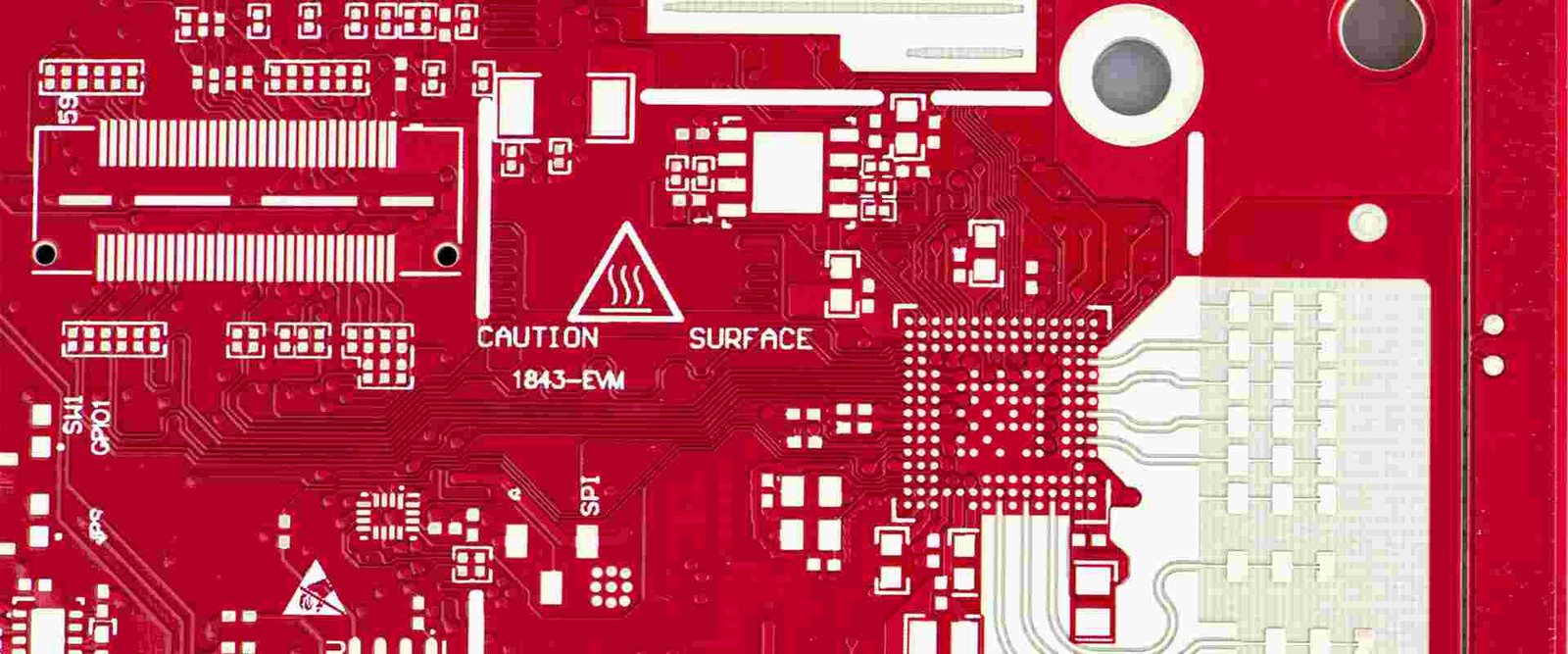 Red circuit board routing | GlobalWellPCB Red bare circuit board with dense component pads, traces and white silkscreen labels