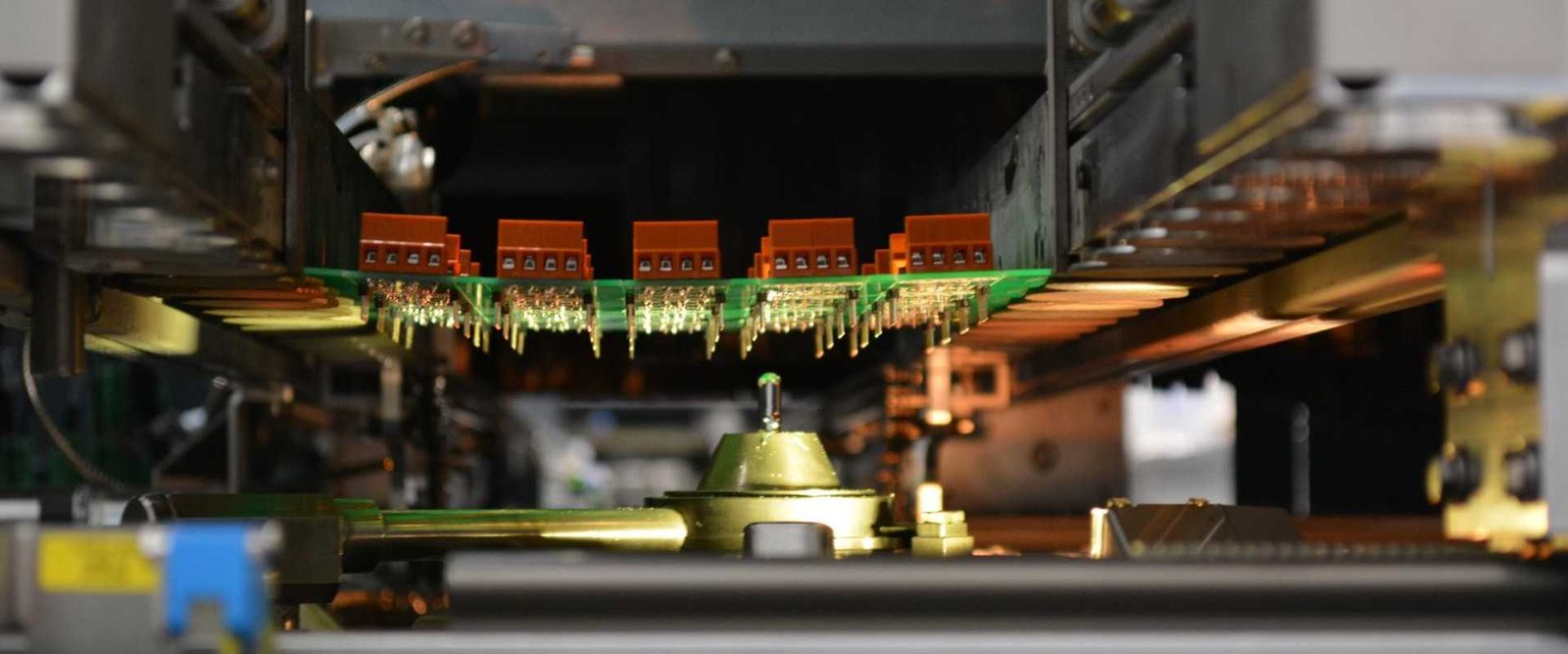 Selective-soldering process example | GlobalWellPCB Electronic circuit-board assembly positioned above a selective-soldering nozzle