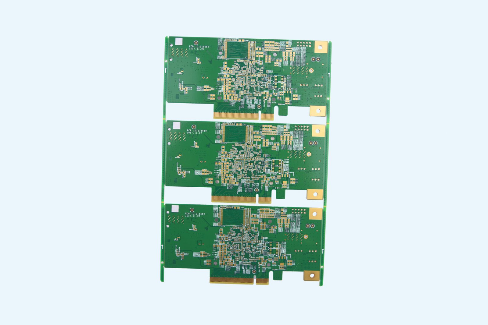 Panel of three green bare printed circuit boards with gold-colored contact fingers and mounting pads