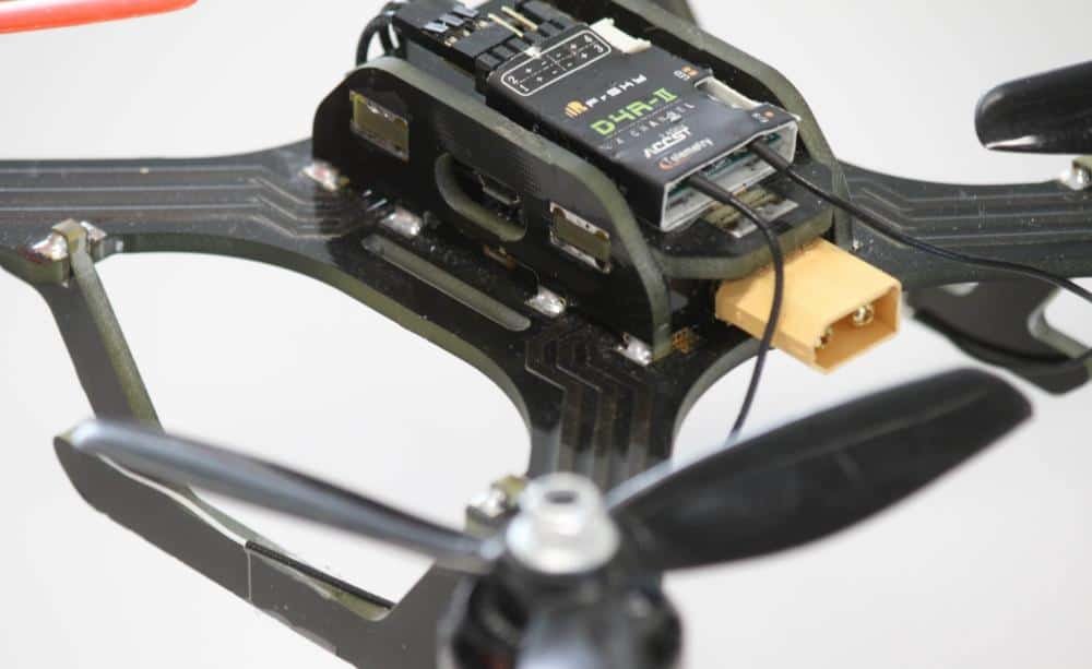 Drone electronics example | GlobalWellPCB Close-up of a small drone frame, propellers, electronics and power connector