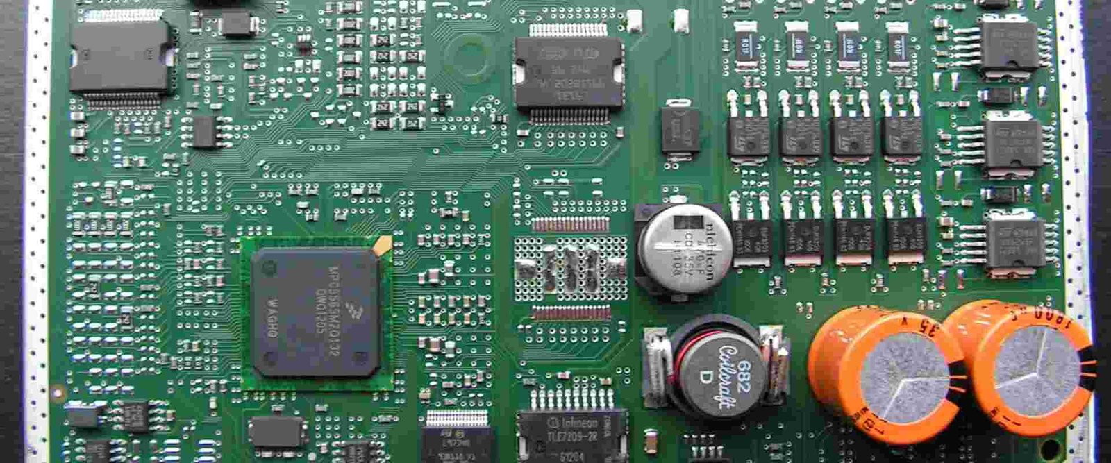 Vehicle electronics board example | GlobalWellPCB Populated electronic circuit board with connectors, capacitors and integrated circuits