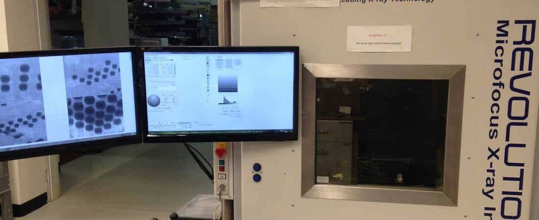 Inspection workstation with a display showing an X-ray image of electronic components