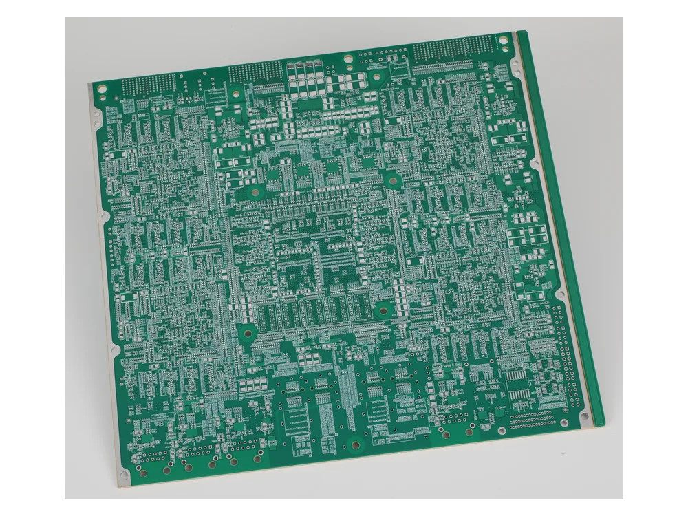 Large green bare PCB panel with dense pad arrays, holes and component footprints.