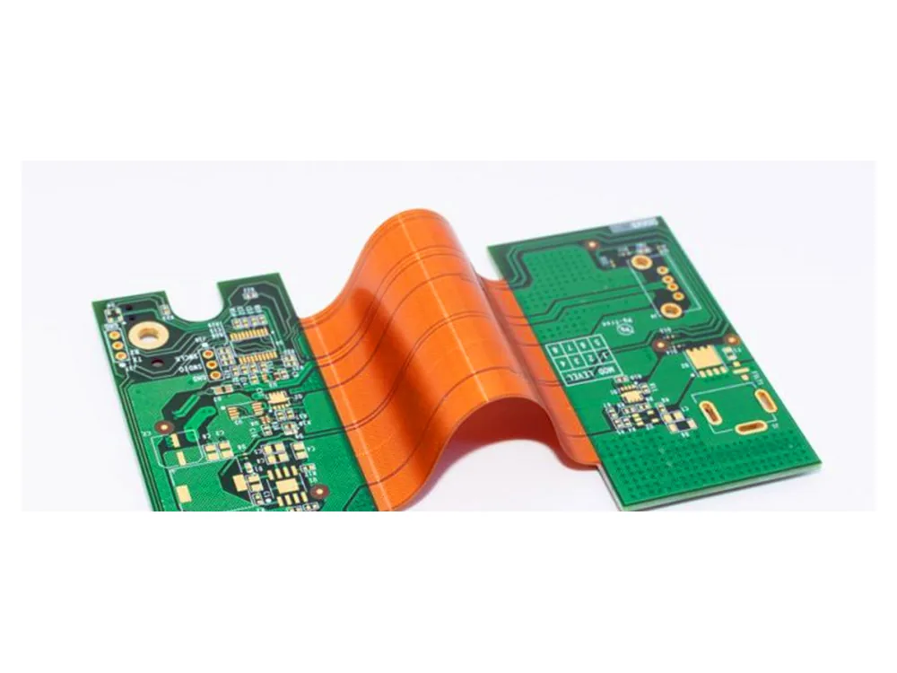 Green rigid PCB sections connected by an orange flexible circuit bent into an arch.